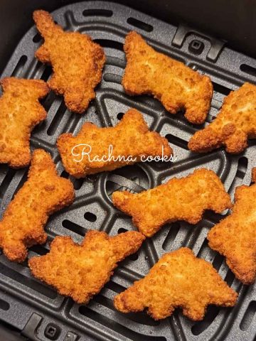 Dino nuggets after air frying in air fryer basket