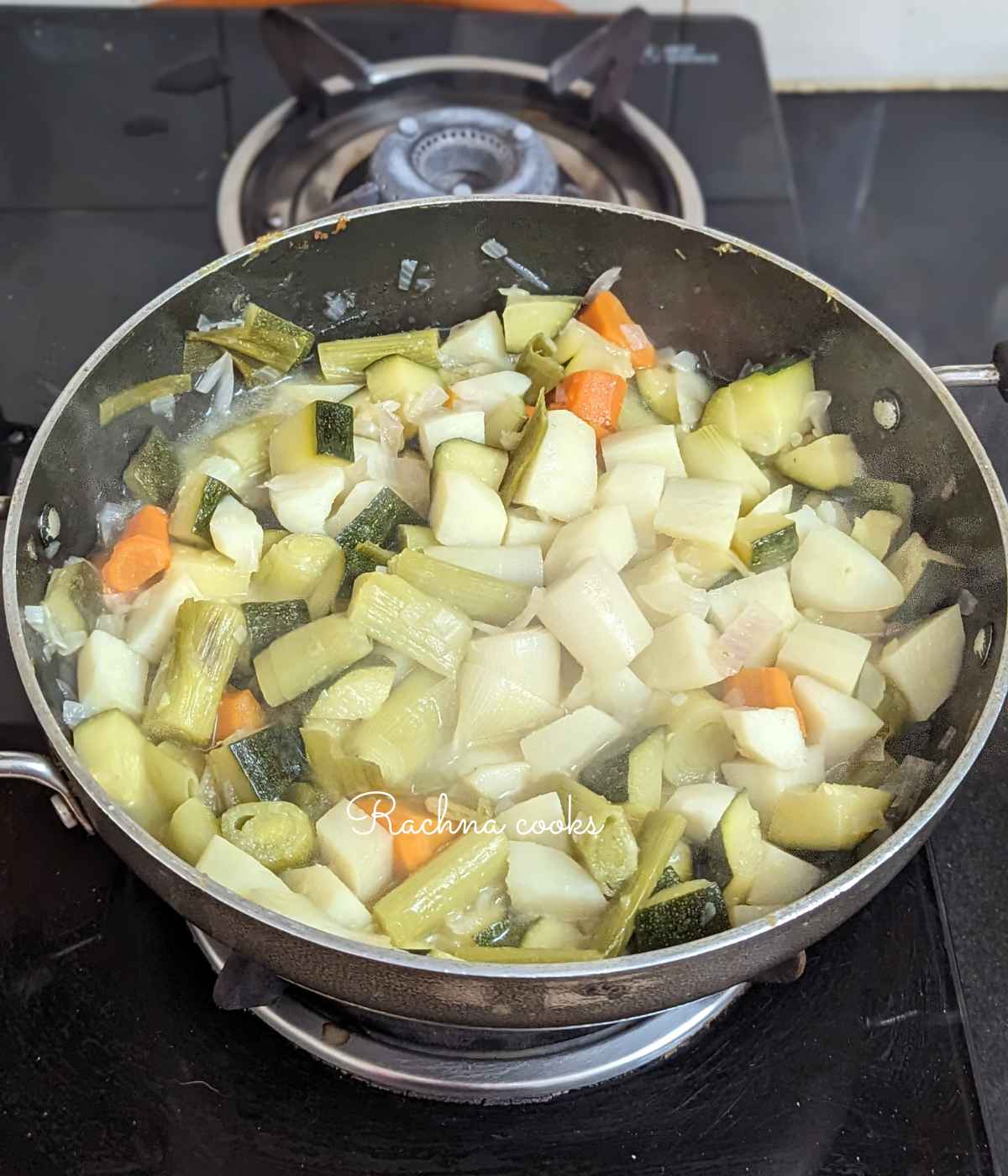 Vegetables being cooked in a pan.
