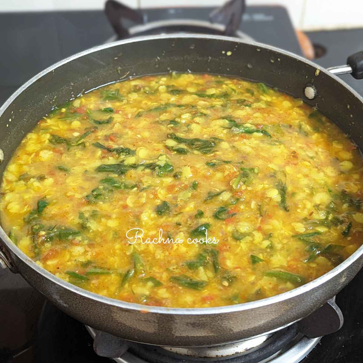 Palak dal is ready to serve in a kadhai.