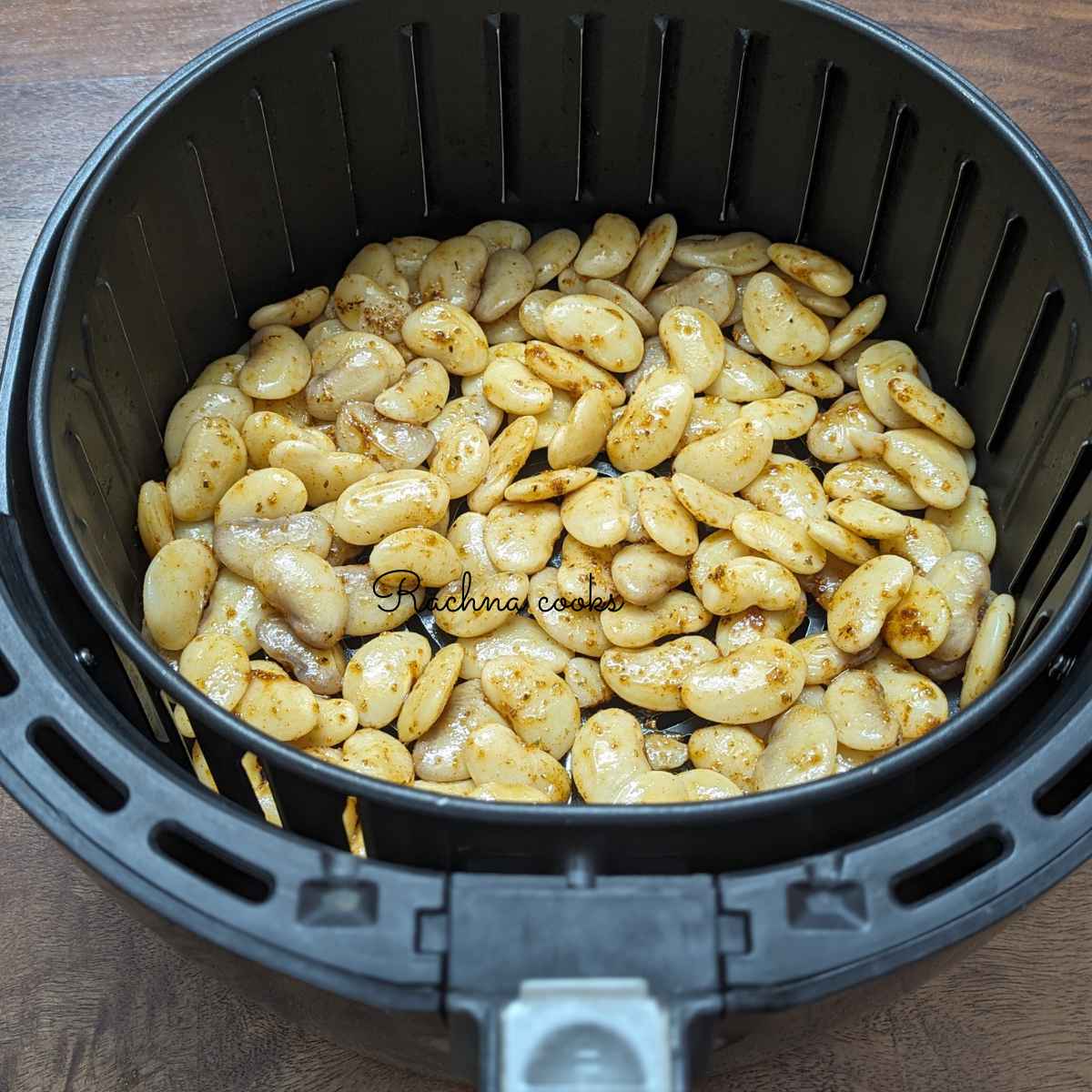 Spiced butterbeans in air fryer basket