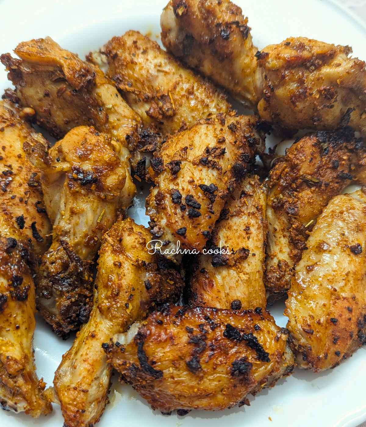 Take chicken wings in a bowl and add the seasoning mix to it. 