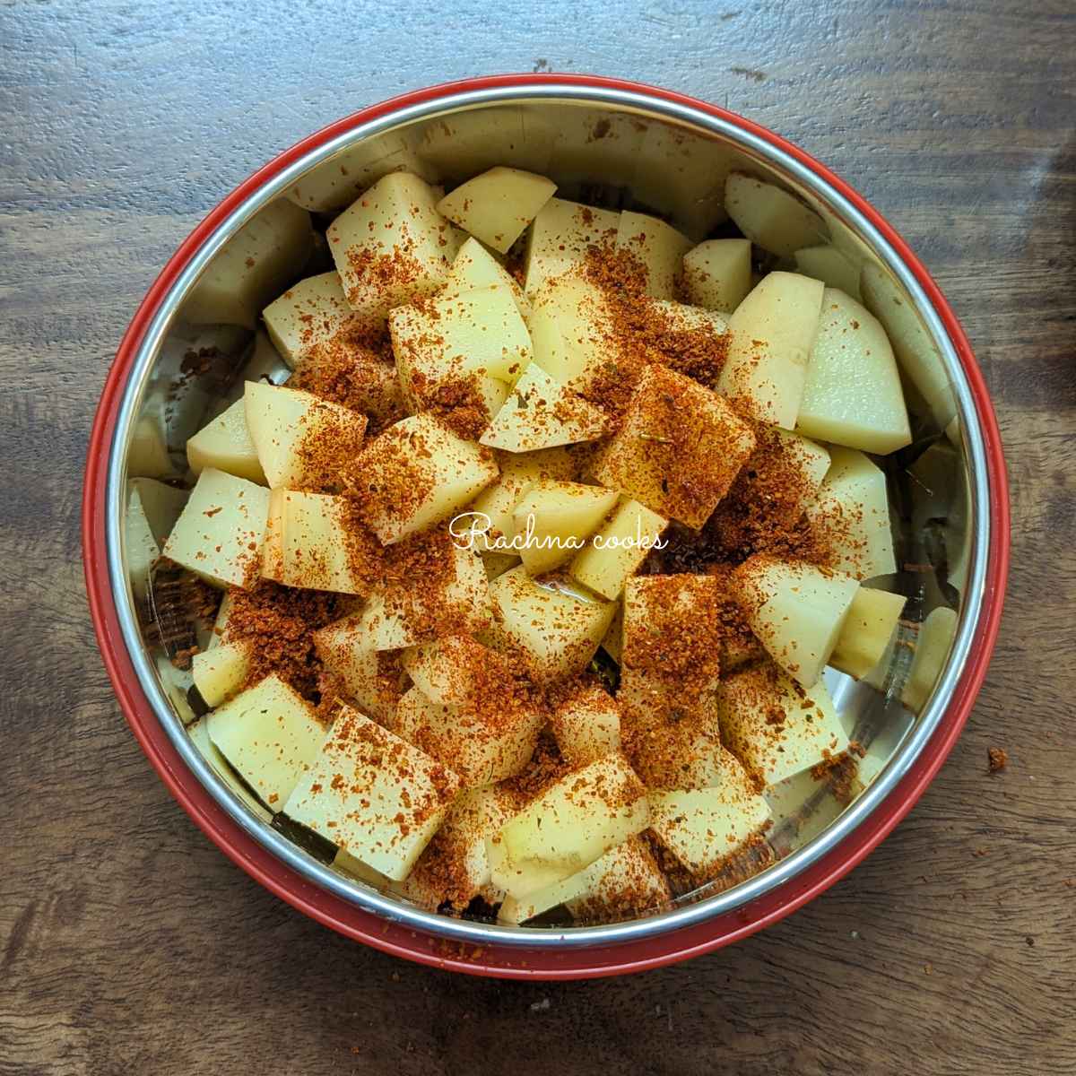 Potato cubes mixed with spice mix and olive oil.