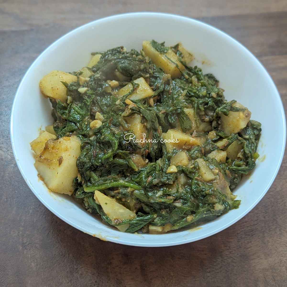Delicious aloo palak served in a bowl.