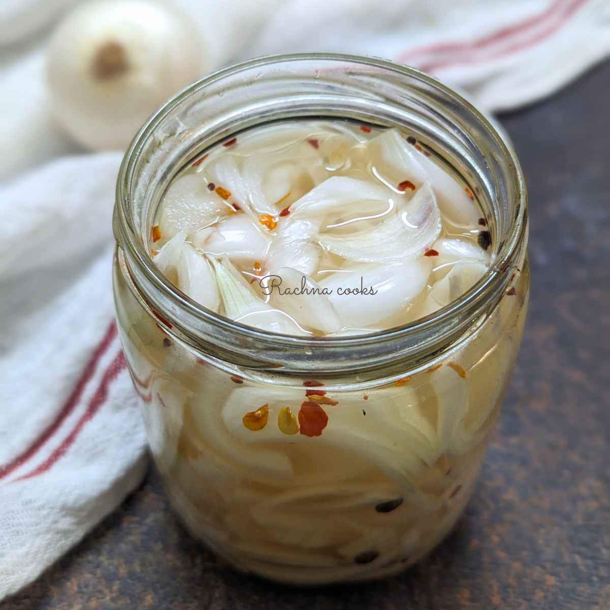 A jar of white pickled onon.