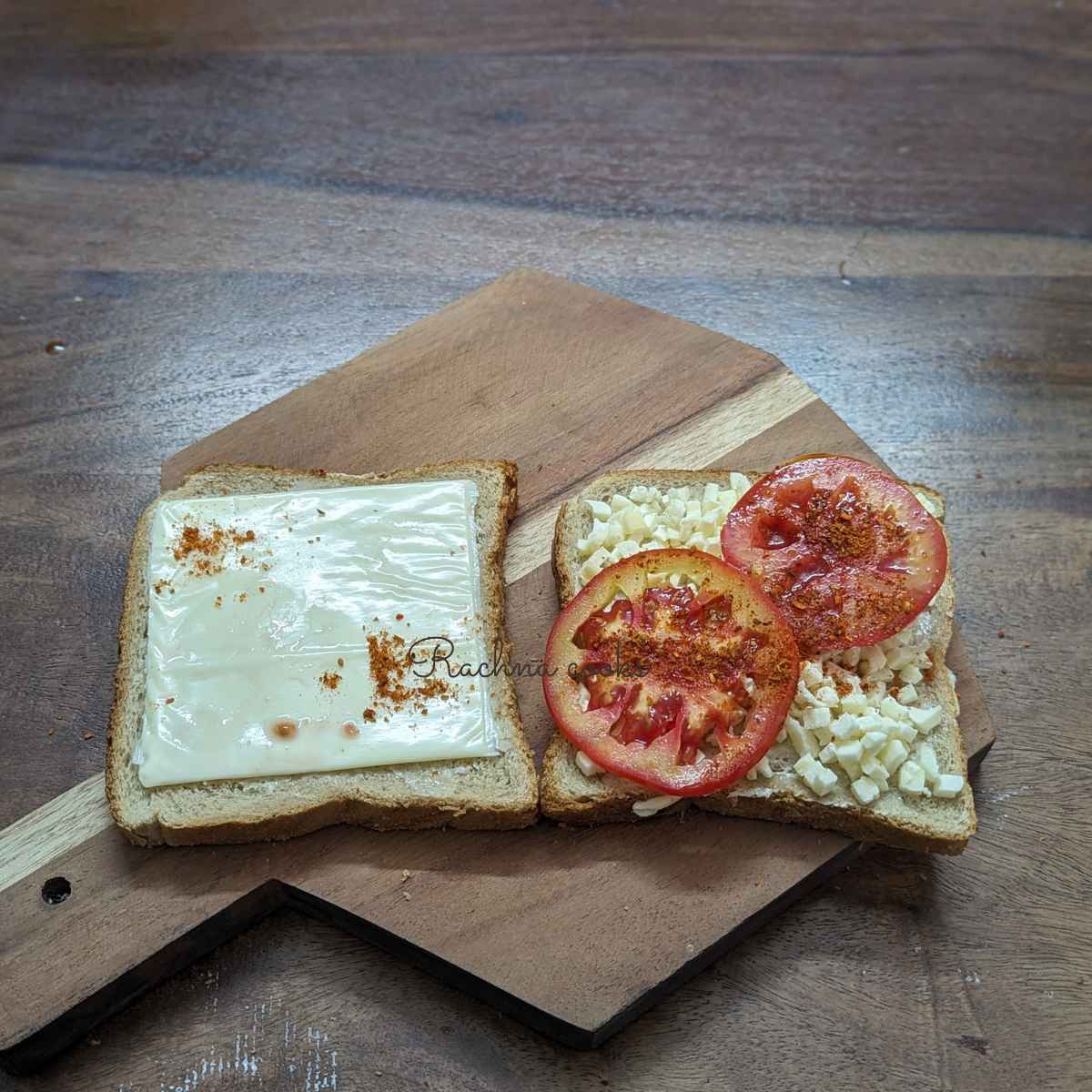 Bread slices with diced cheese, tomato slices and cheese slices.