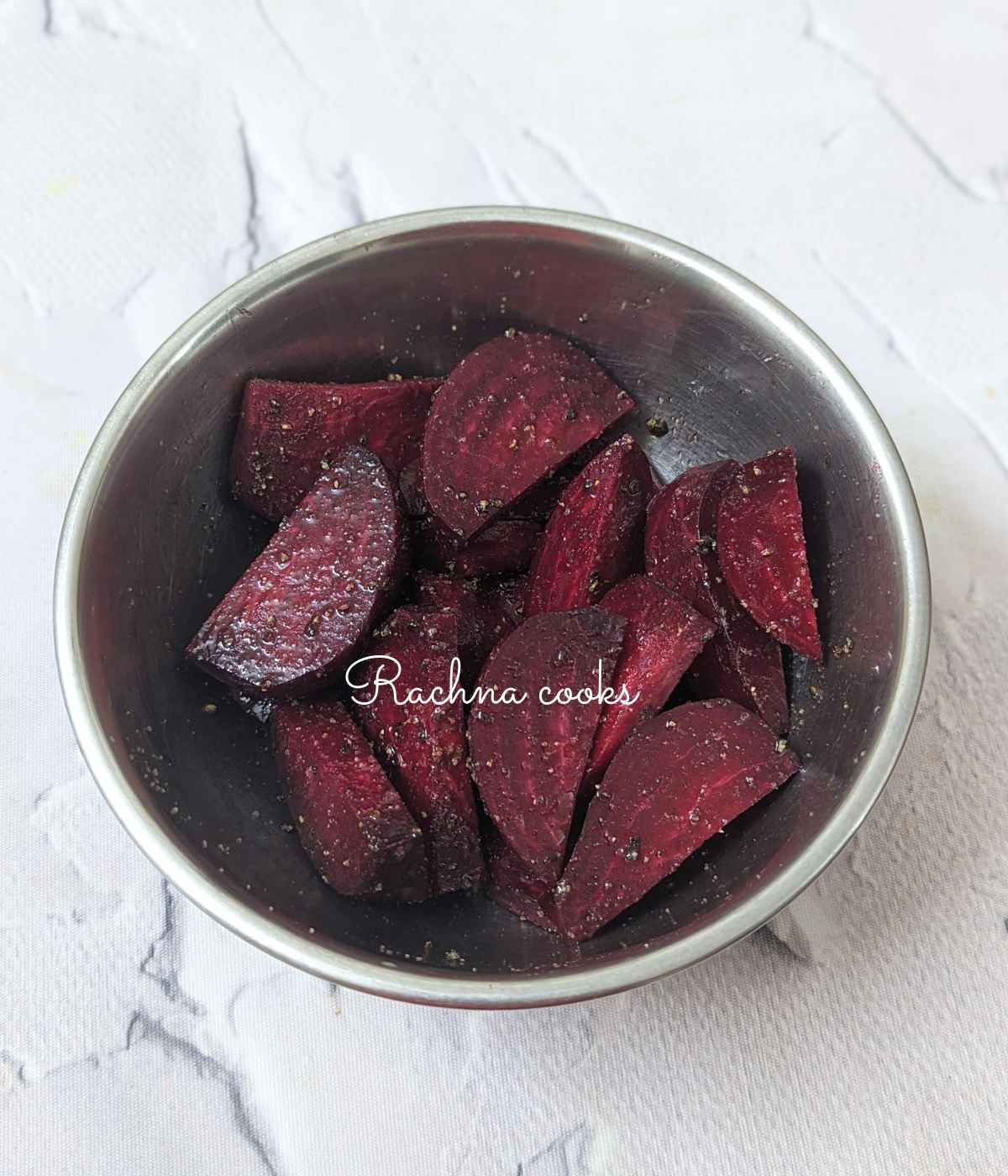 Beetroot wedges tossed with salt, pepper and olive oil.