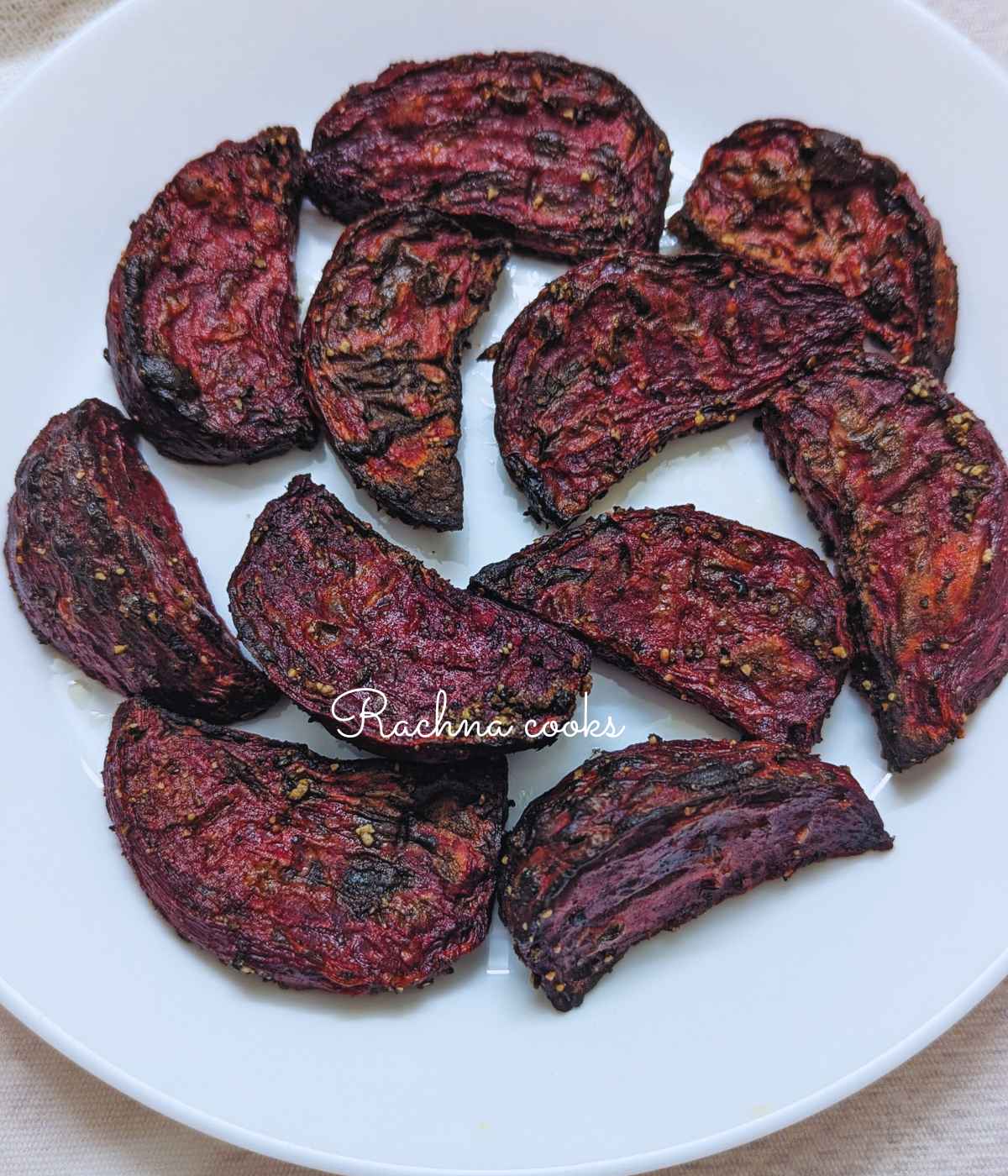 Roasted beets served on a white plate