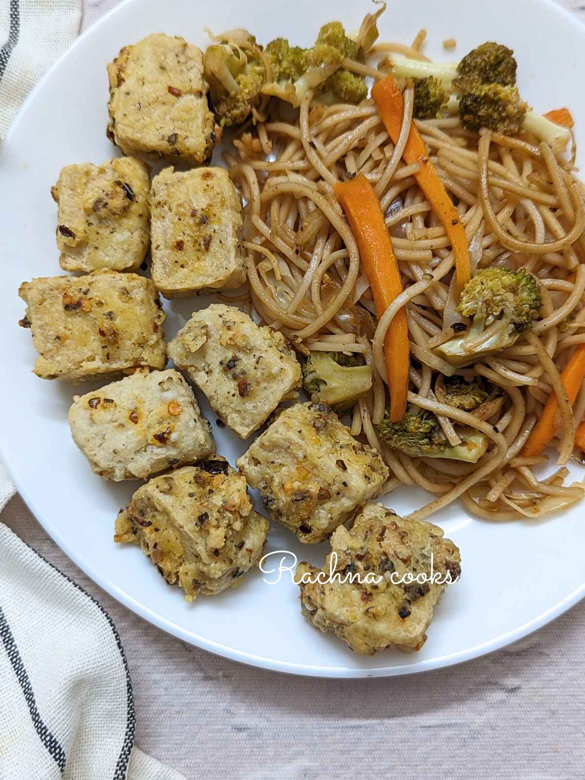 Salt and pepper tofu served with noodles.