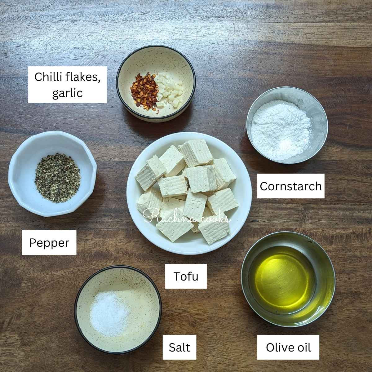 Ingredients for salt and pepper tofu on a board.
