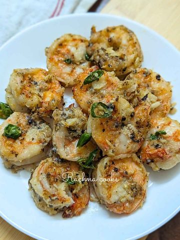 Salt and pepper shrimp on a white plate