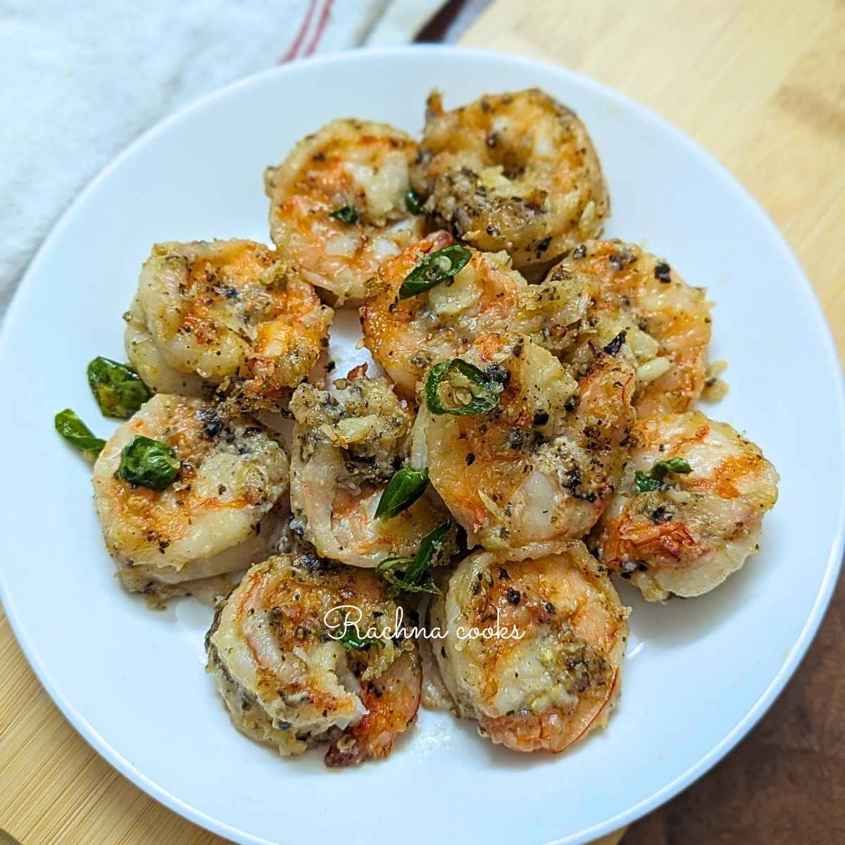 Delicious salt and pepper shrimp on a white plate.