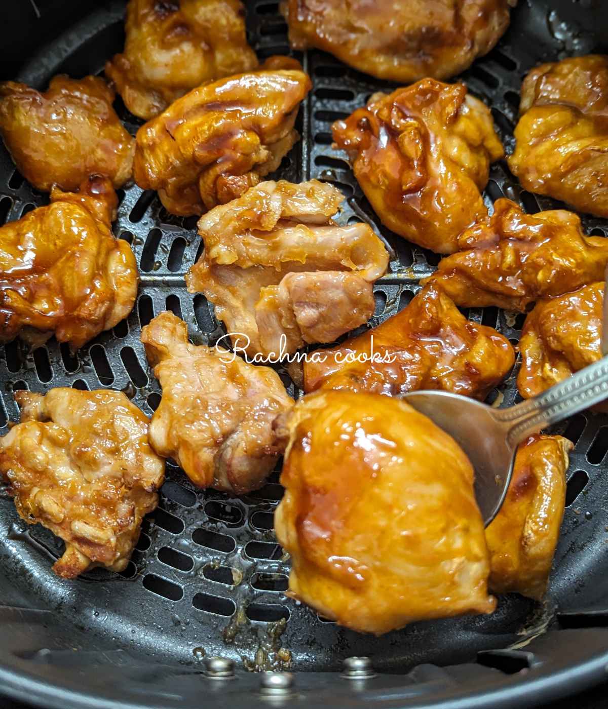 Teriyaki sauce being applied to the chicken being cooked