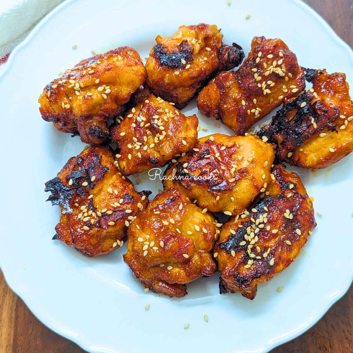 Air fried teriyaki chicken served on a white plate.