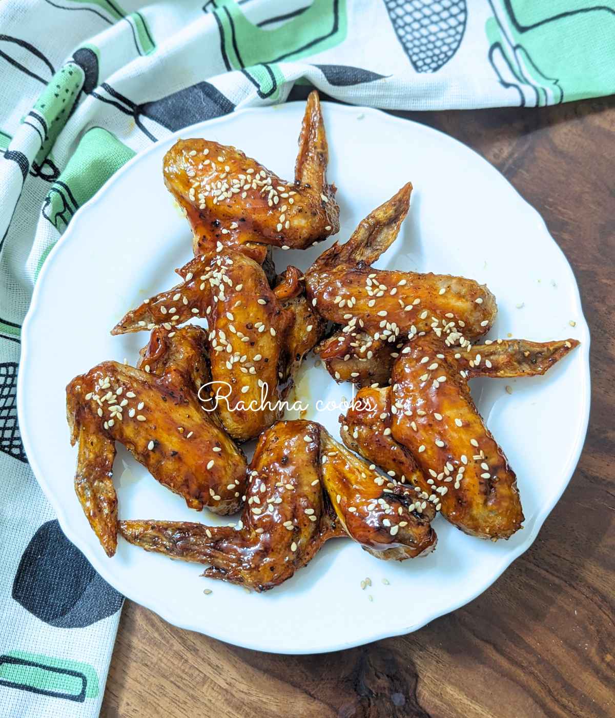 Teriyaki chicken wings served on a white plate.