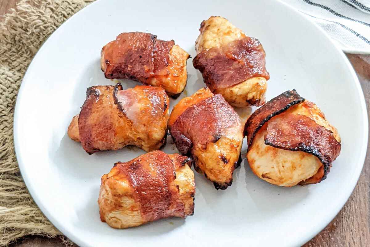 Delicious bacon wrapped chicken bites served on a plate