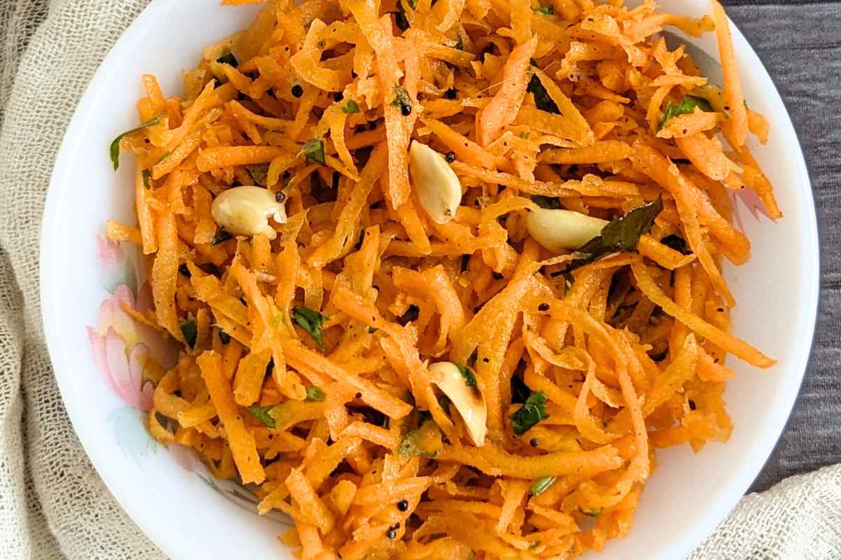 A bowl of grated carrot salad