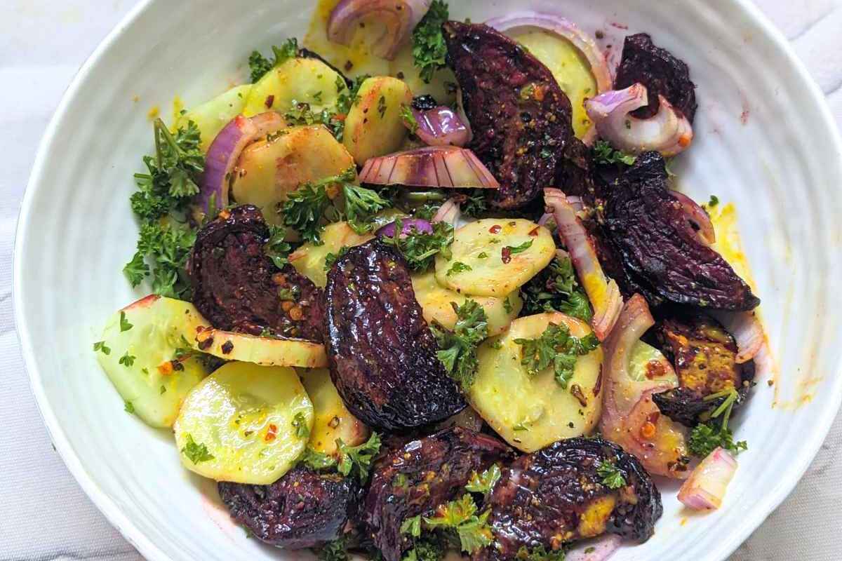 A bowl of roasted beet and cucumber salad