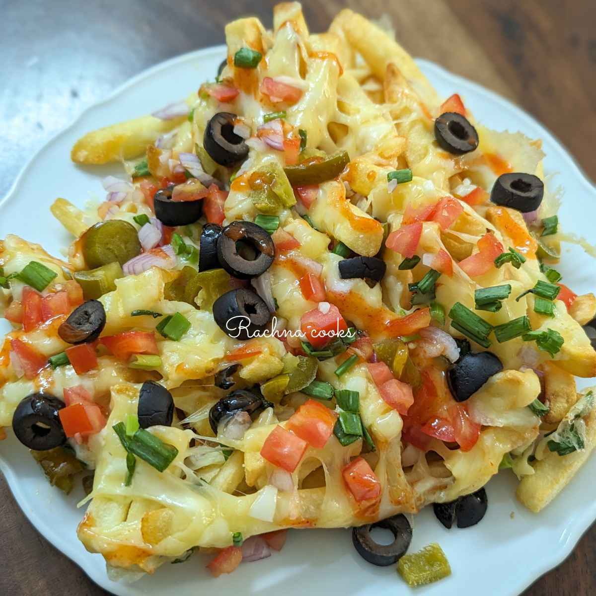 Delicious loaded fries topped with melted cheese and toppings.