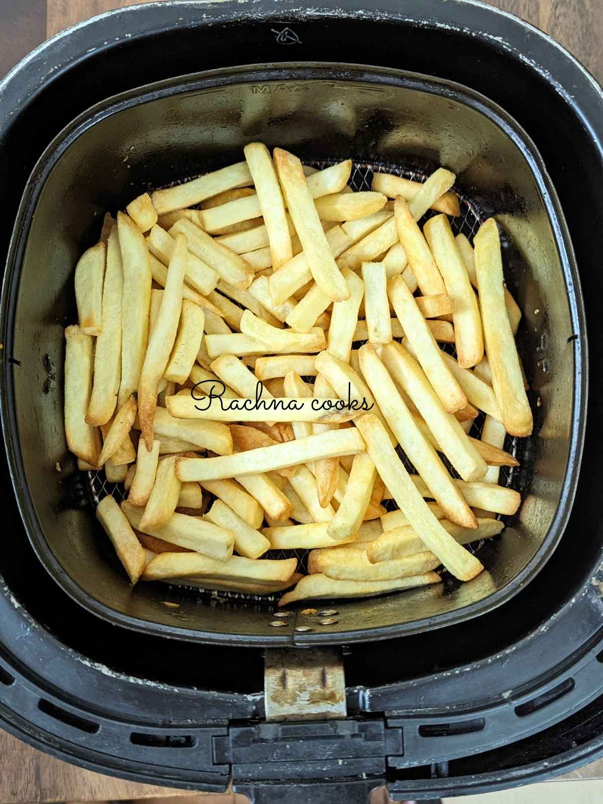 Air fried french fries in air fryer basket