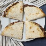 4 quesadillas served on a plate