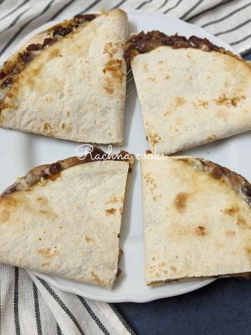 4 quesadillas served on a plate