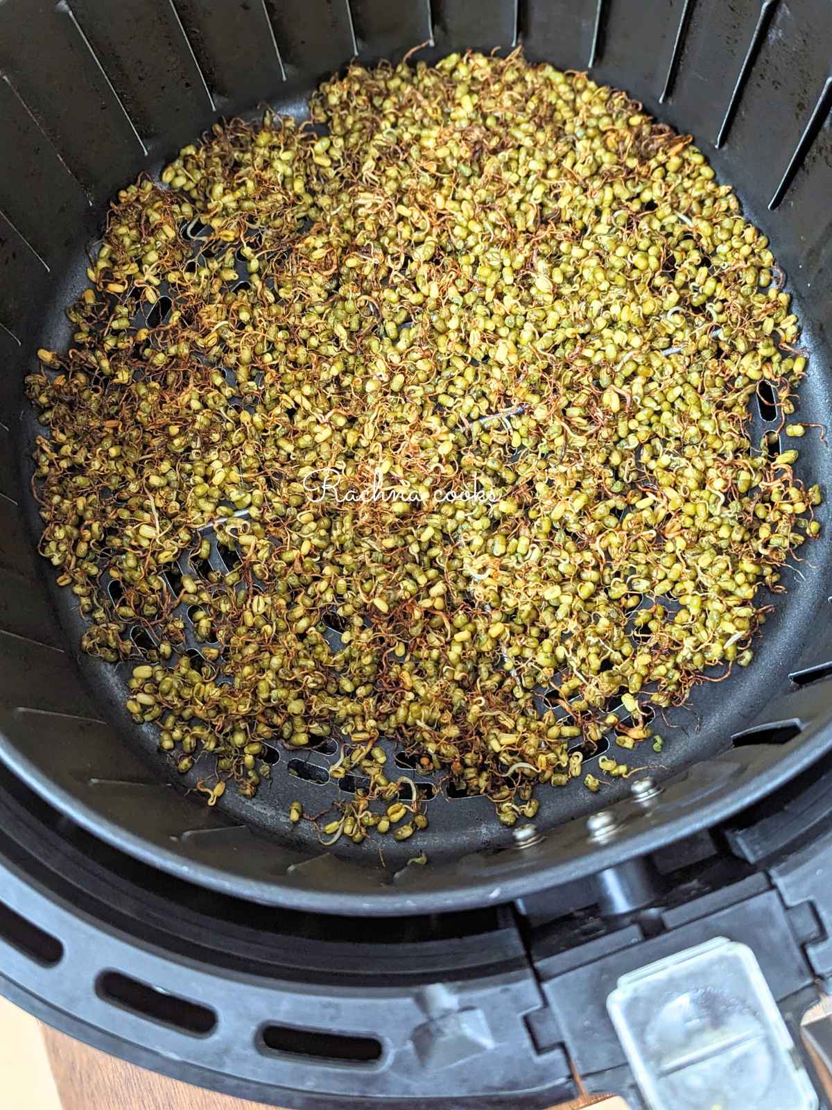 Air fried roasted moong sprouts in air fryer basket