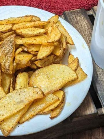A plate of potato wedges on a plate