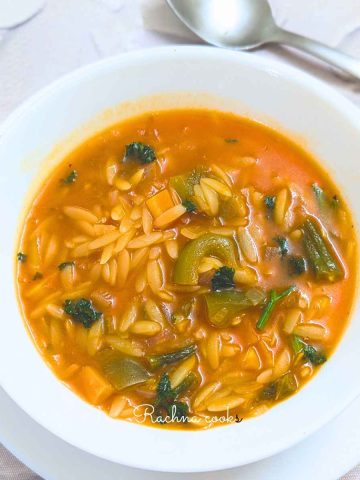 A bowl of orzo vegetable soup