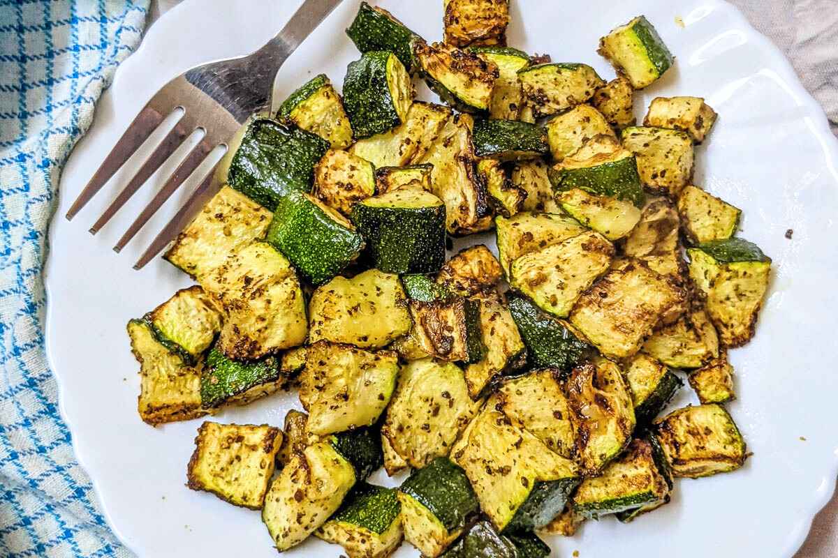 Roasted zucchini on a white plate