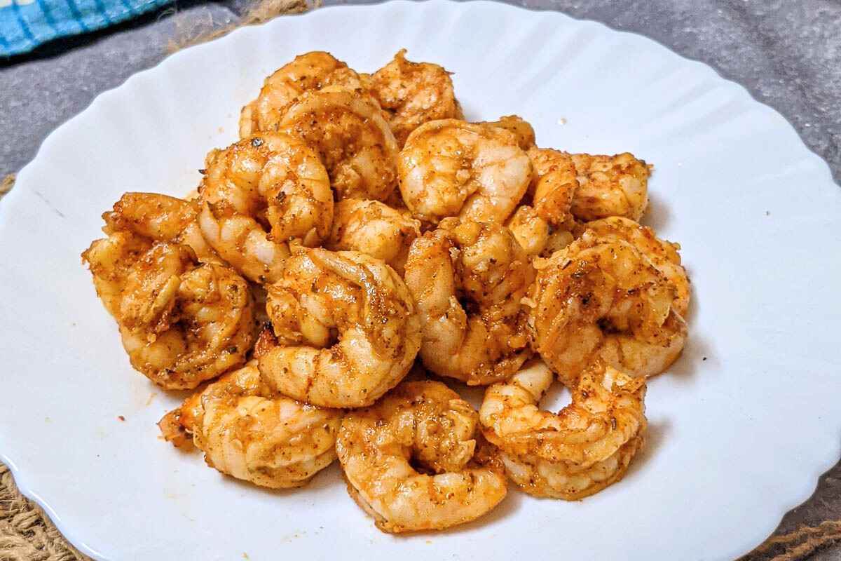 Delicious Cajun shrimp on a white plate