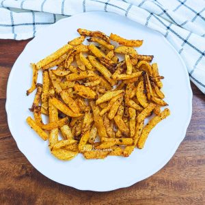 Air fried kohlrabi fries on a white plate