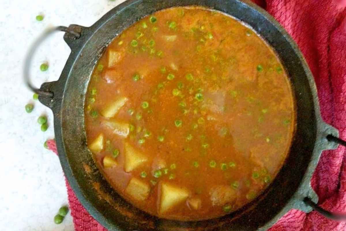 Delicious aloo matar curry in a wok