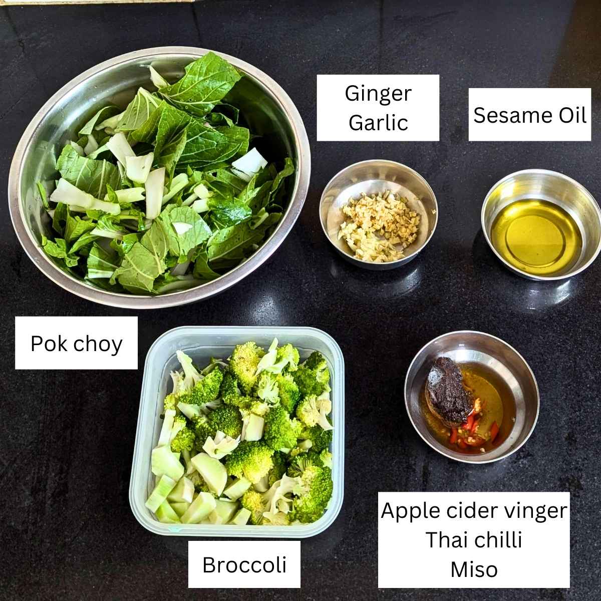 Ingredients for making broccoli pok choy stir fry on a board