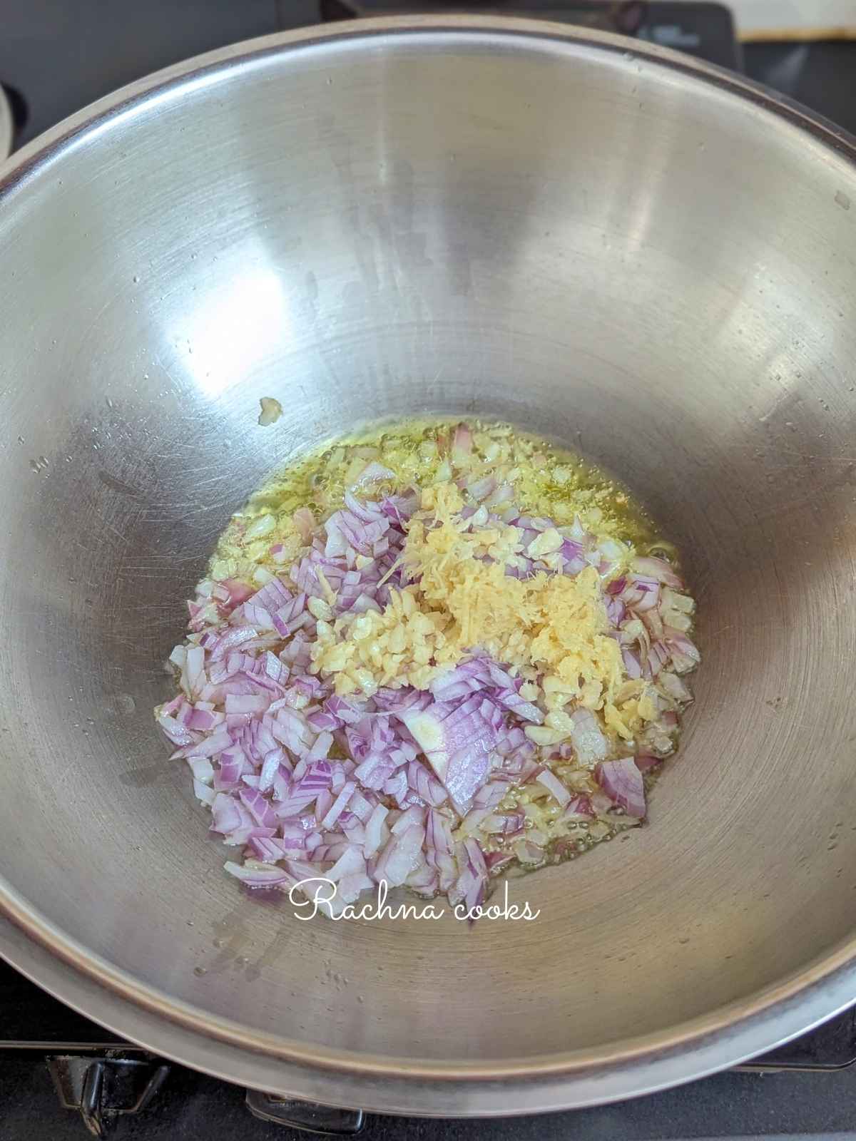 Onion, ginger and garlic being sauteed in oil