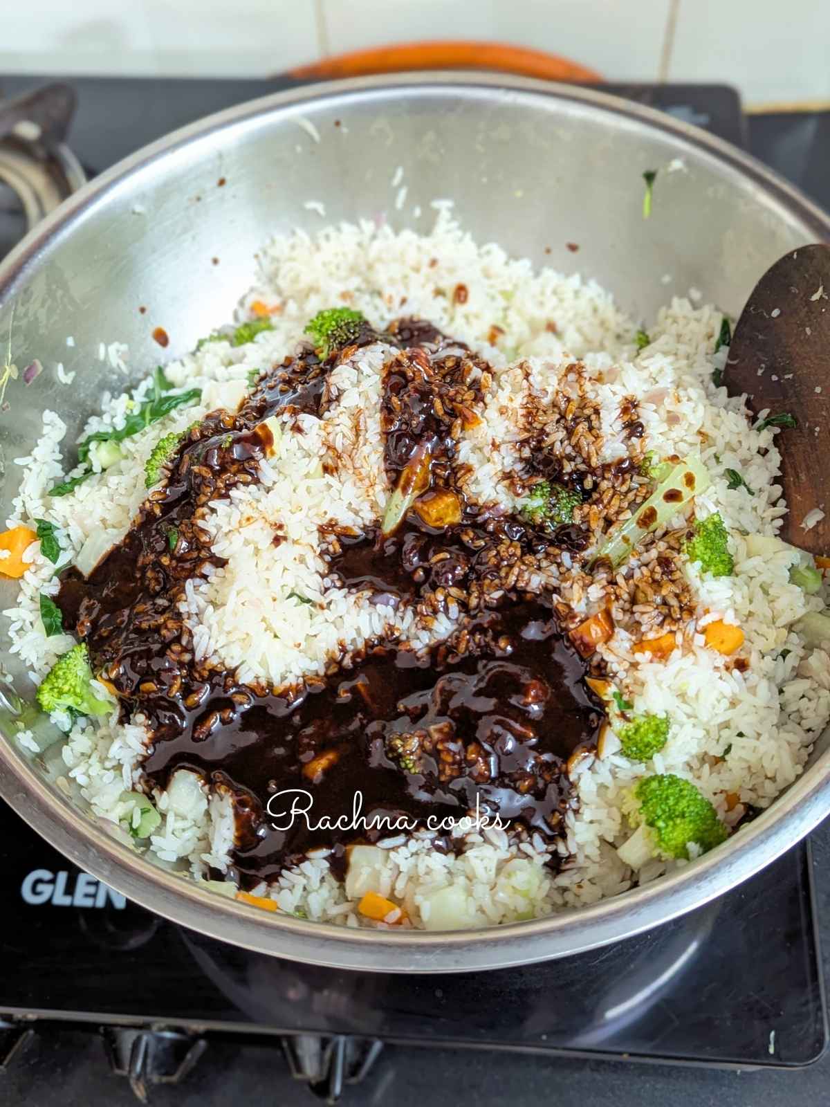 Gochujang sauce on rice and veggies in a pan