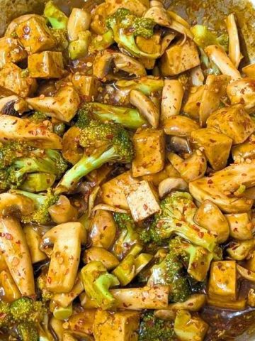 Tofu broccoli and mushroom stir fry in a pan