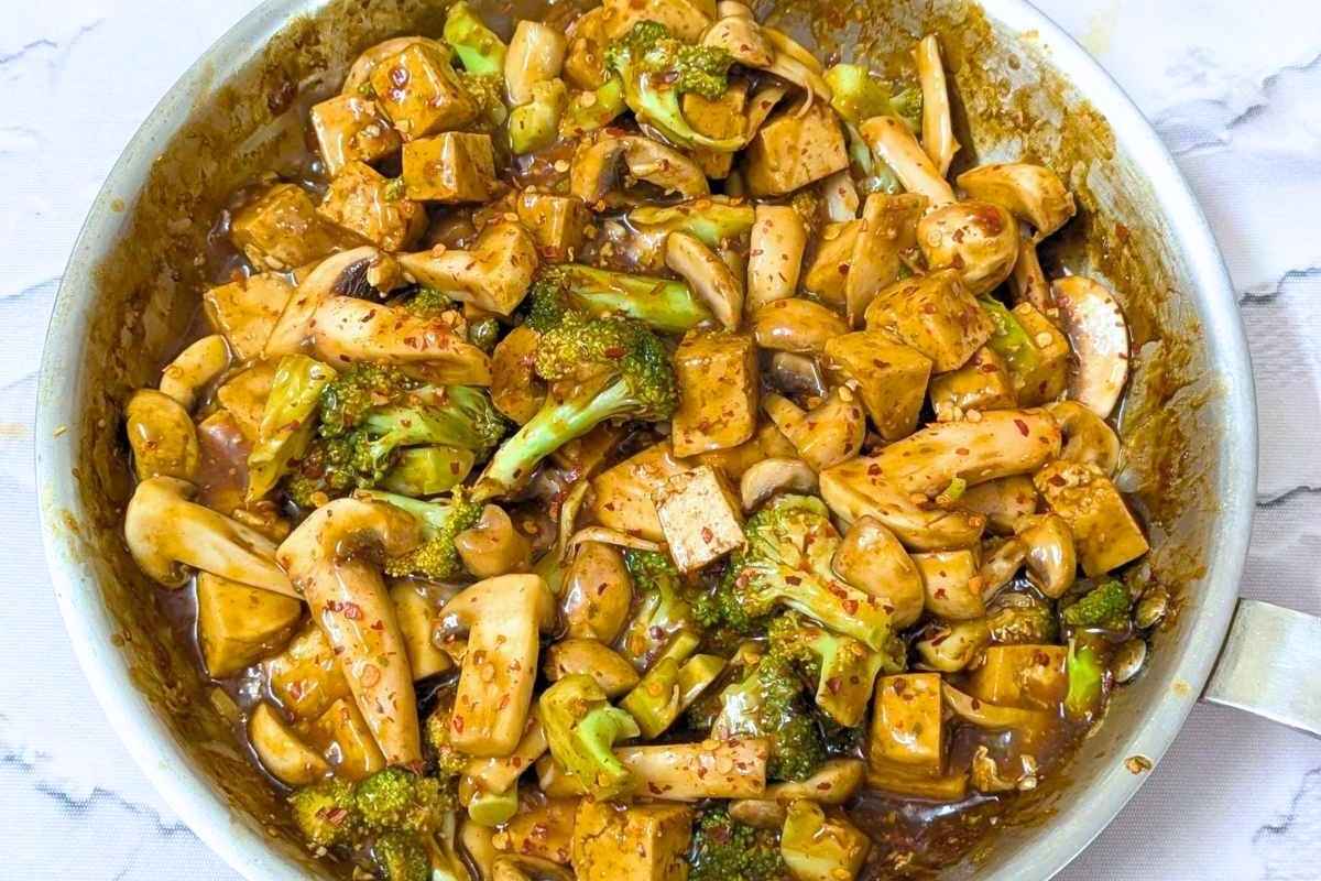 Tofu broccoli and mushroom stir fry in a pan