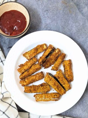 Eggplant fries on a plate served with ketchup