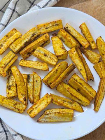 Plantain fries served on a white plate after air frying