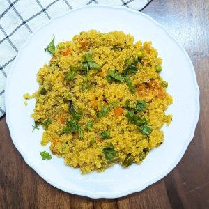 Delicious quinoa upma served on a plate