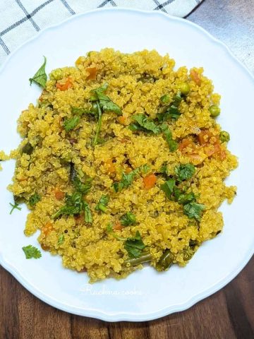 Delicious quinoa upma served on a plate