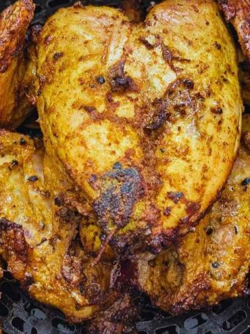 Whole chicken in air fryer basket