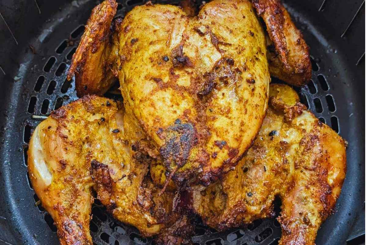 Whole chicken in air fryer basket