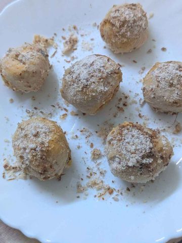 Air fryer donut holes on a white plate