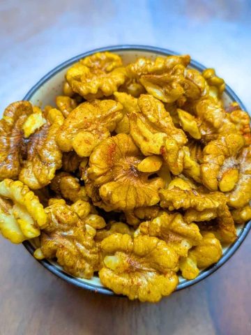 Air fried walnuts in a bowl