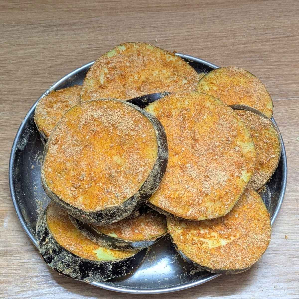 Seasoned eggplant slices on a plate