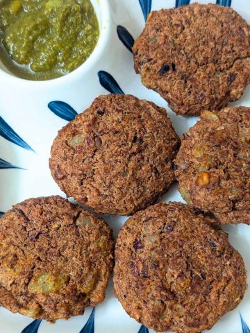 5 Rajma cutlets served in a plate with green chutney