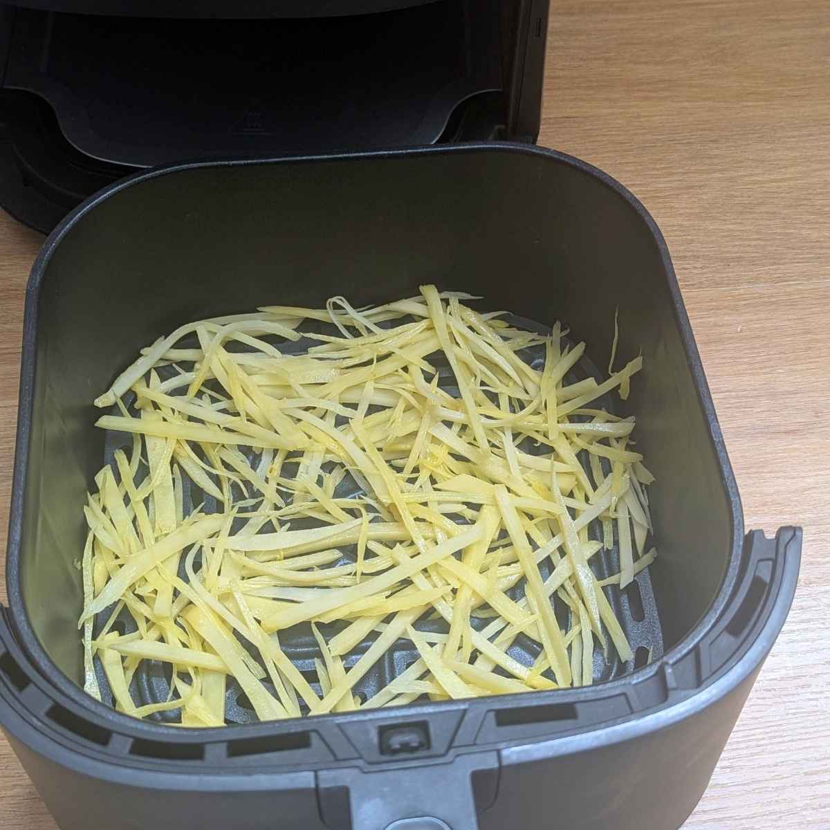 Shoestring fries in air fryer basket