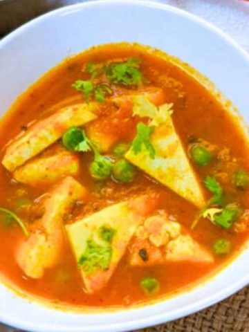 Matar paneer curry in a bowl