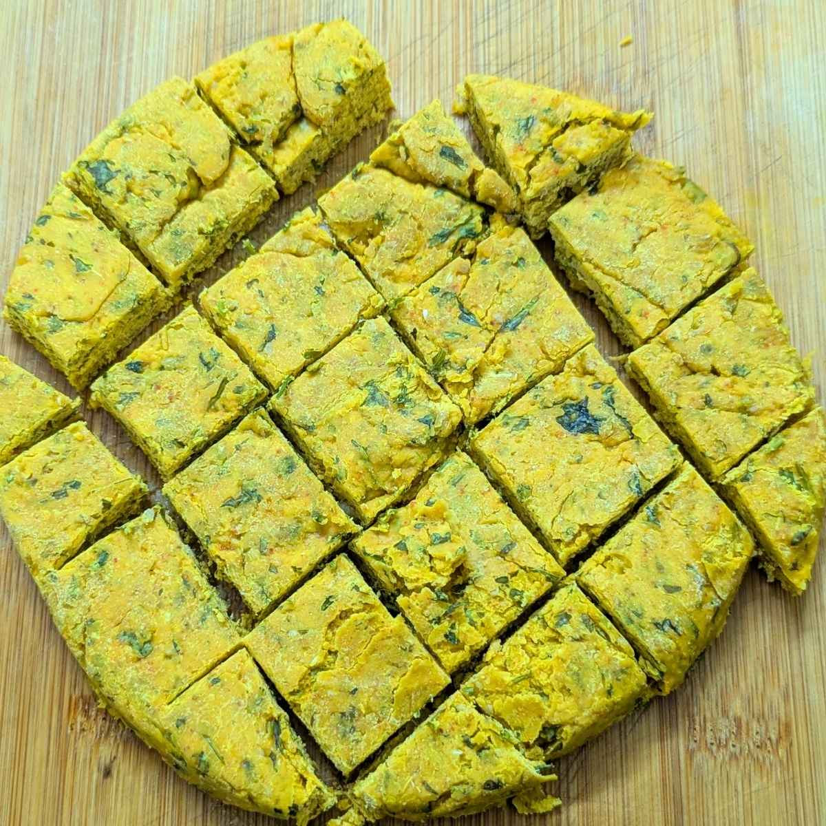 Steamed kothimbir vadi cut into squares